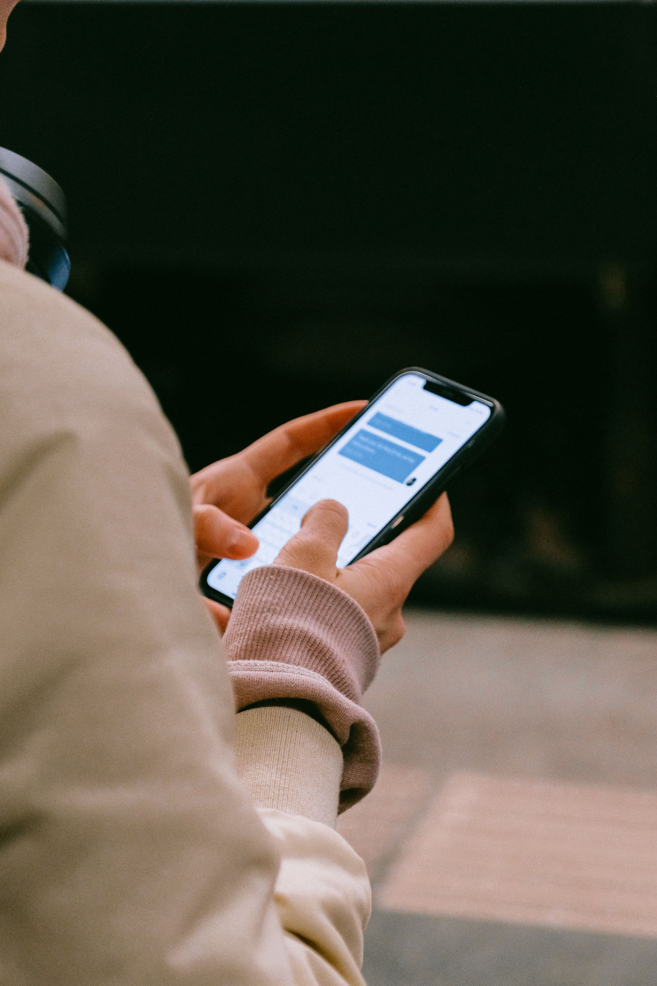 A customer messaging a business chat bot on a phone